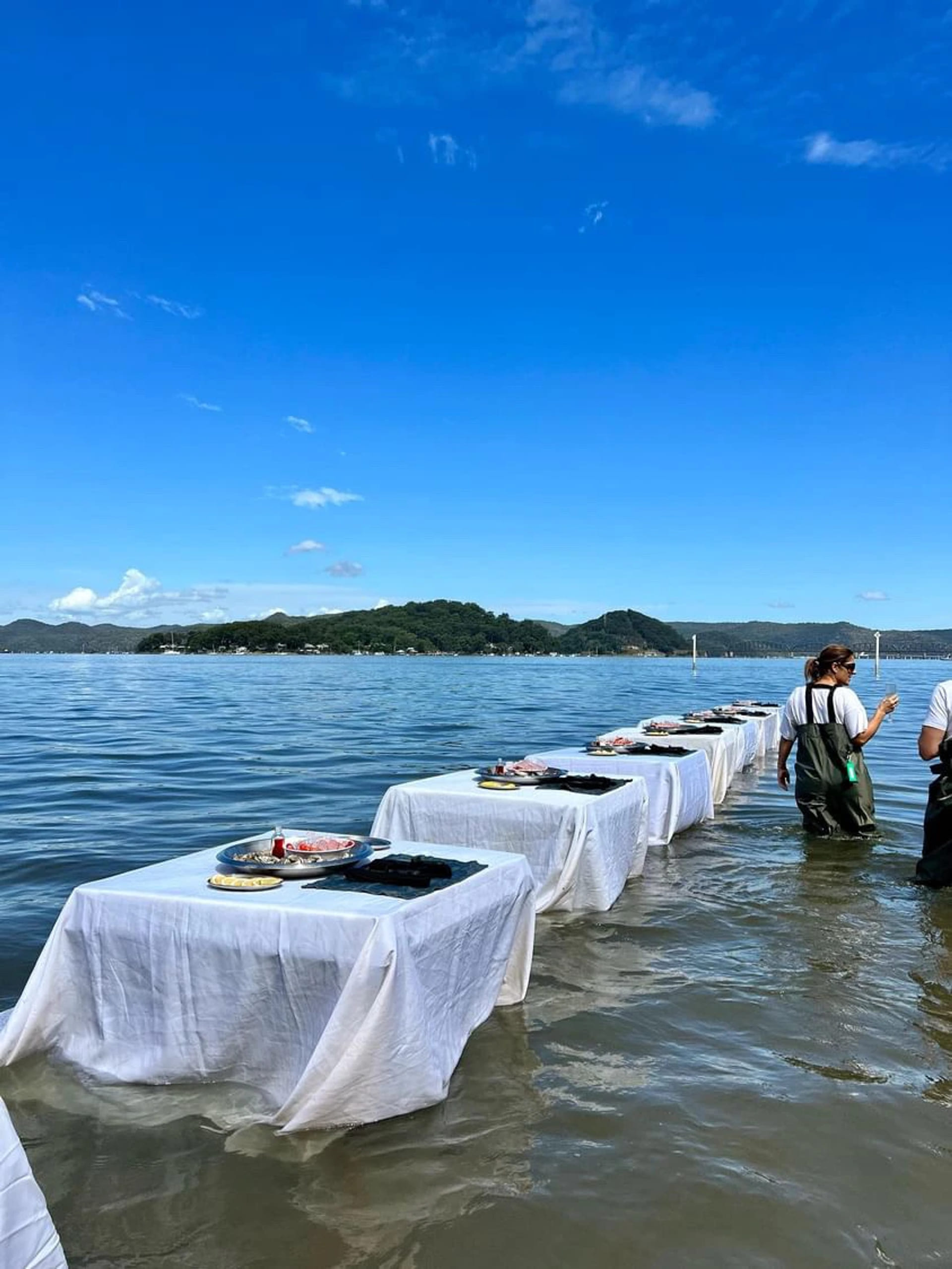 In water tables set up for guests, sunny day